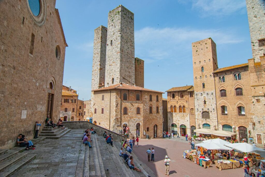 People at Piazza del Duomo in San Gimignano, Italy