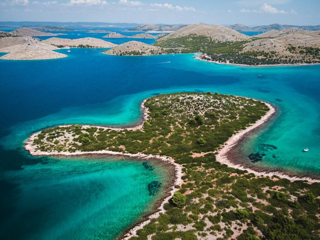 an aerial view of an island in the middle of the ocean